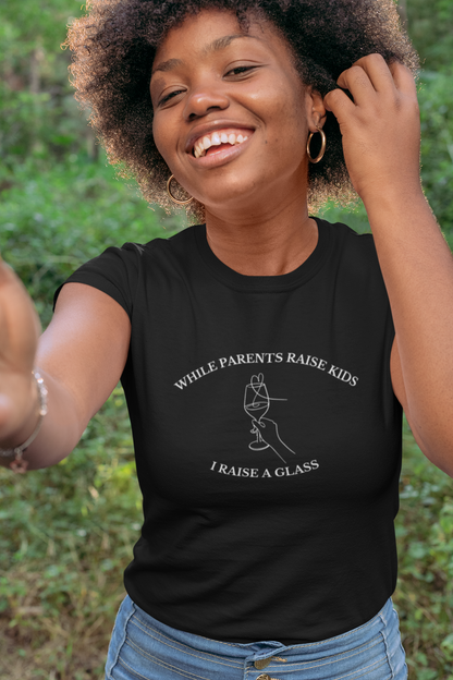 Funny T-shirt: While Parents Raise Kids I Raise a Glass